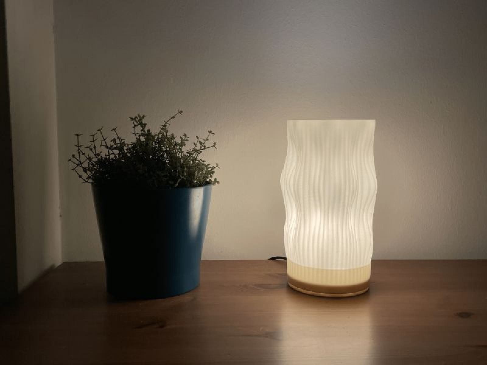 The lamp on a desk, lit from within